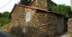Traditional stone house with courtyard on the banks of the river Miño