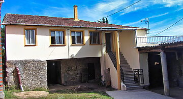 Country home with a small garden and outbuildings