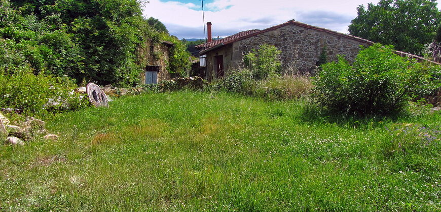 Tastefully renovated stone house with outbuildings and garden near the river Cabe