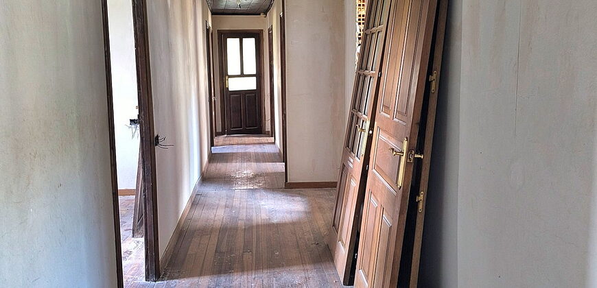 Partially renovated stone house with land in an attractive location